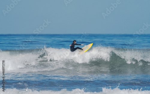 surfing the wave on the beach of La Serena Chile
