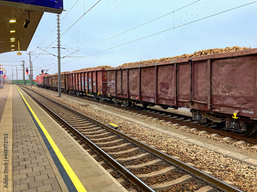 road train with sugar beets in a trainstation photo
