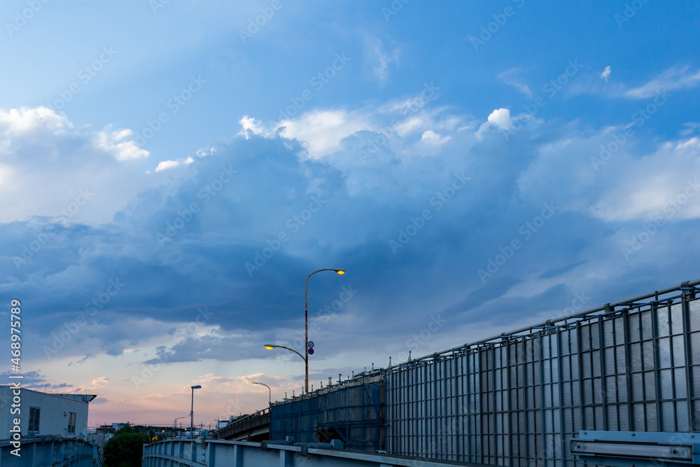 Overpass under repair and sky at dusk