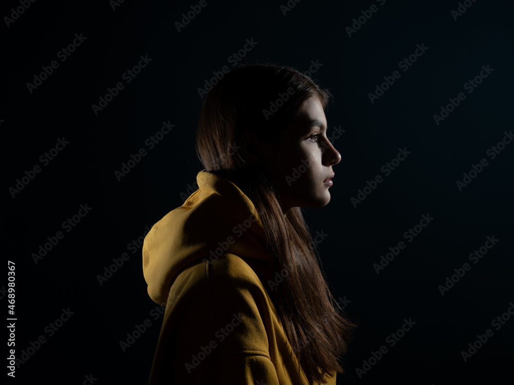 Confident look ahead, concept. A young Caucasian woman, side view of the illuminated silhouette of the head, looks to the right. The mysteries of the subconscious, the brain and the mind Confident look ahead, concept. A young Caucasian woman, side view of the illuminated silhouette of the head, looks to the right. The mysteries of the subconscious, the brain and the mind