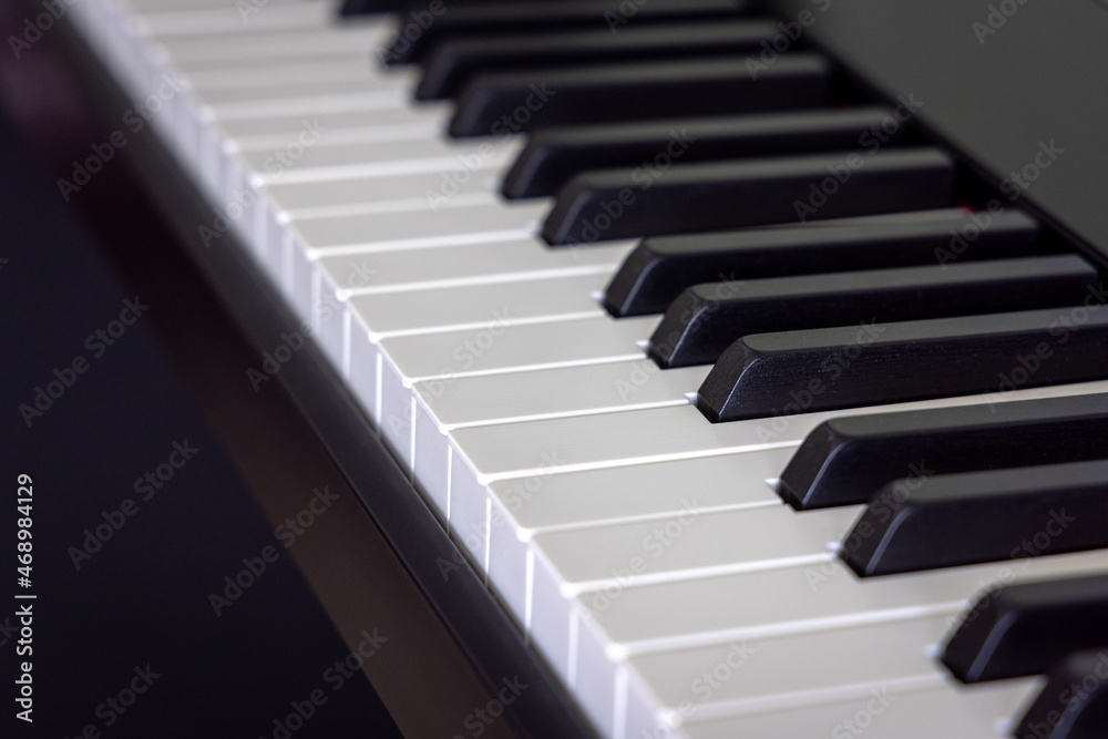 Closeup of classical electronic piano keyboard with black ebony and white ivory key. Musical instrument. Closeup of classical electronic piano keyboard with black ebony and white ivory key. Musical instrument.