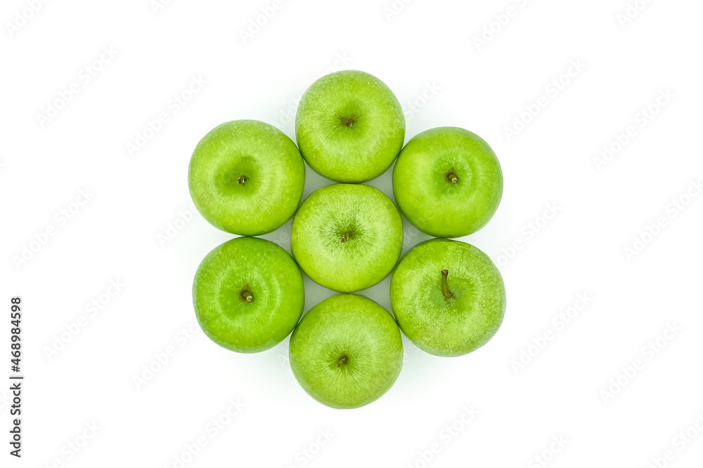 Obraz premium Top close-up view green apples 7 appetizing green apples on the white surface