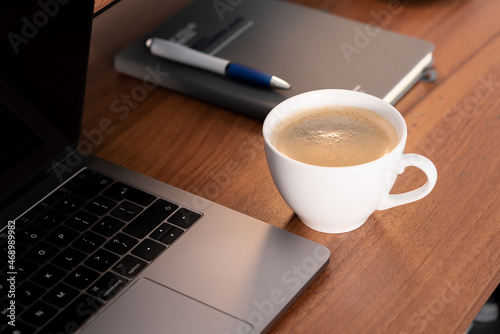 A cup of coffee on a work desk