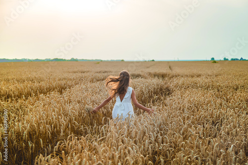 A child in a wheat field. Selective focus. © yanadjan