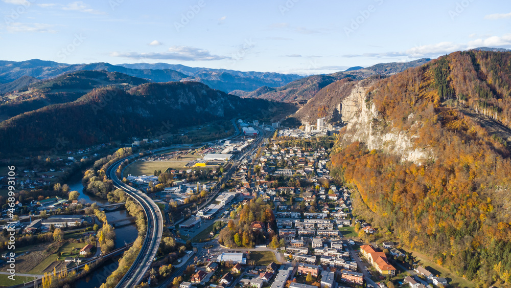 Aerial view of Peggau with the impressive rock face Peggauer Wand during autumn