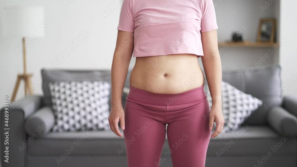 Abdominal massage, tummy tuck and flabby skin on a fat belly, woman