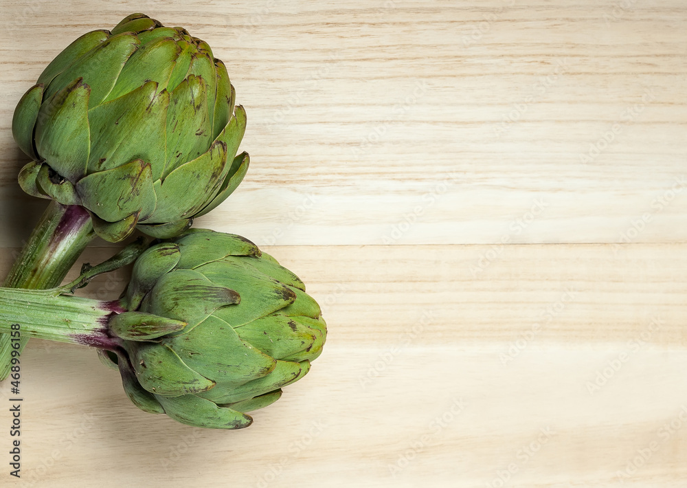 Fototapeta premium artichoke on wood background