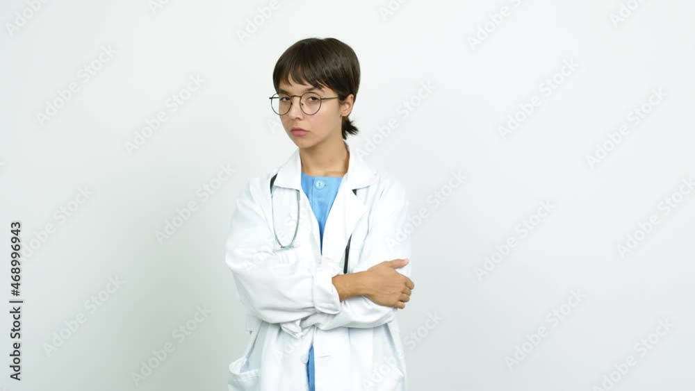 Young woman with nurse uniform looking side over isolated background Young woman with nurse uniform looking side over isolated background