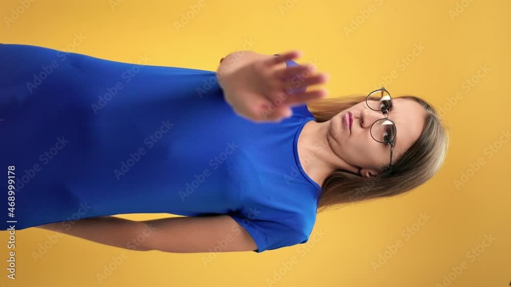 VERTICAL VIDEO POV portrait confident woman making not decline gesture posing isolated on orange VERTICAL VIDEO POV portrait confident woman making not decline gesture posing isolated on orange