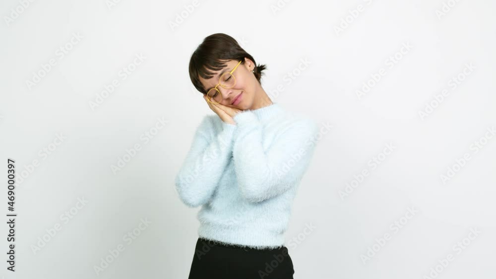Young woman making sleep gesture. Adorable and sweet expression over isolated background Young woman making sleep gesture. Adorable and sweet expression over isolated background