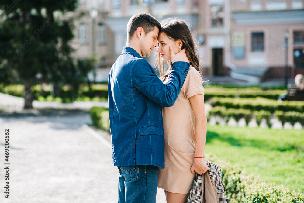 guy and a girl happily walk in the morning on the empty streets guy and a girl happily walk in the morning on the empty streets