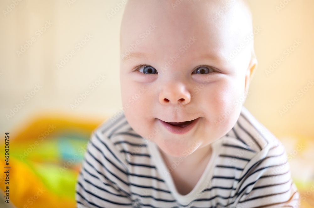 Smiling newborn baby boy