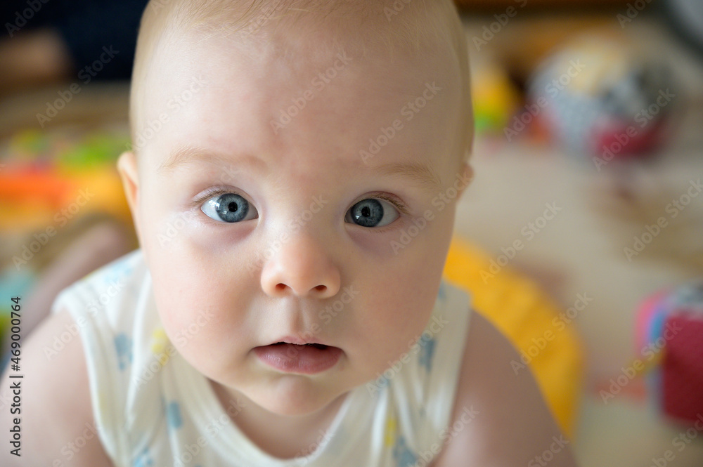 Baby portrait. Closeup face with bright blue eyes Baby portrait. Closeup face with bright blue eyes
