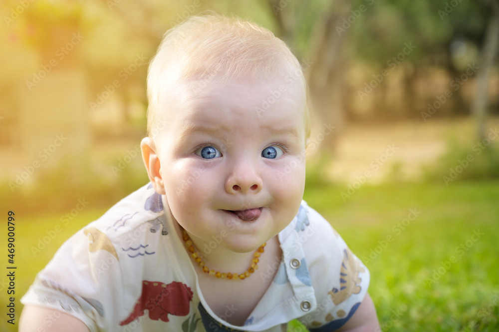 Close up portrait of funny baby boy playing outdoors Close up portrait of funny baby boy playing outdoors
