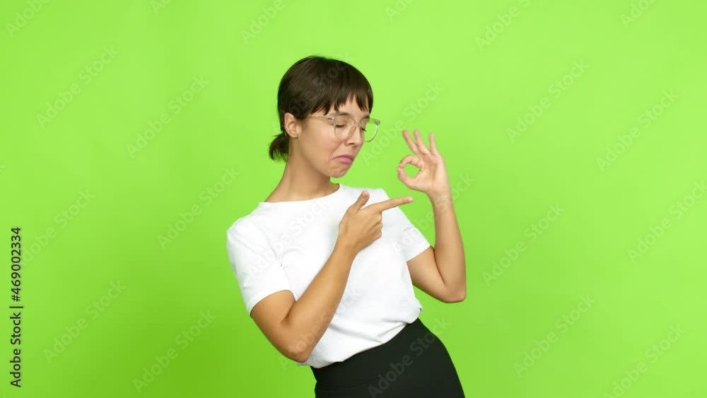 Young woman presenting something over isolated background. Green screen chroma key Young woman presenting something over isolated background. Green screen chroma key