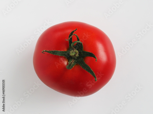 Top view. A close-up of a ripe red tomato.