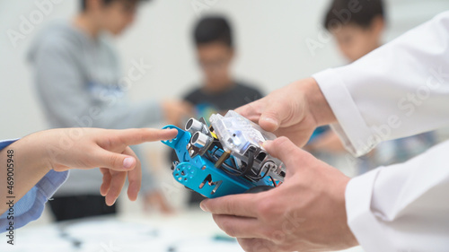 Children learning aurdione in lab.  Programing arduino. Making roboticts program. Techonology and robotic icon. photo