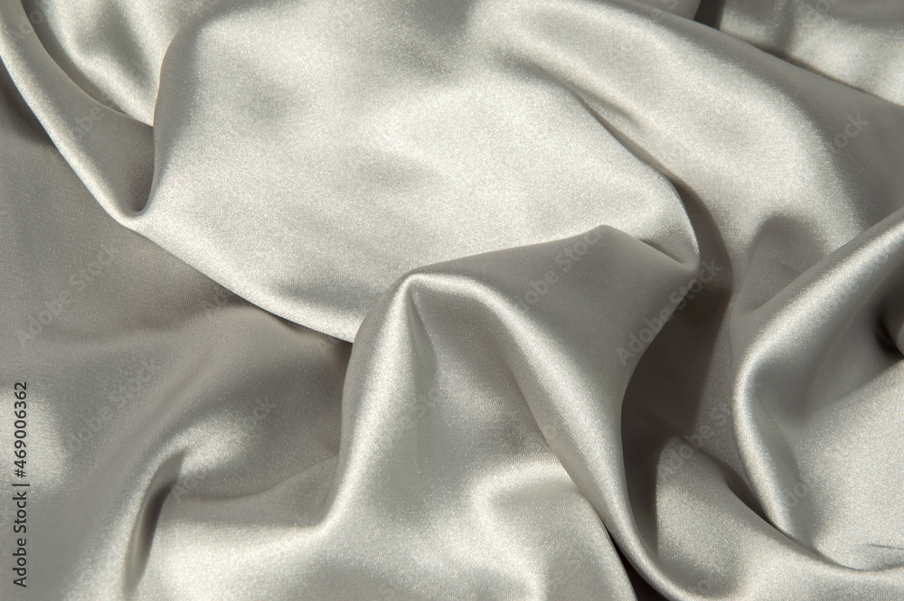 Silk background. Silk gray. Suit fabric. Artistic sheen fabric Stock