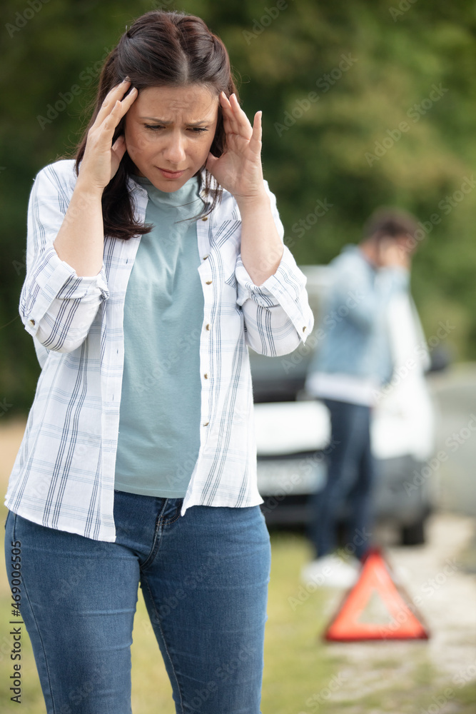 woman is stressed after car malfunction