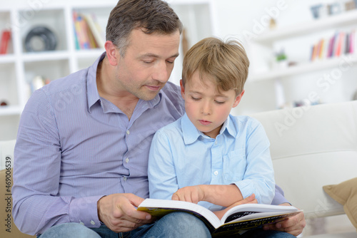 dad and his son reading a book