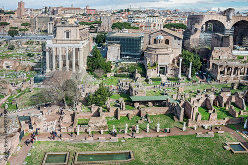 The Roman Forum or Foro Romano is a rectangular forum (plaza) surrounded by the ruins of several ancient Roman Empire government buildings. The Senate House, government offices, tribunals, temples, an photo