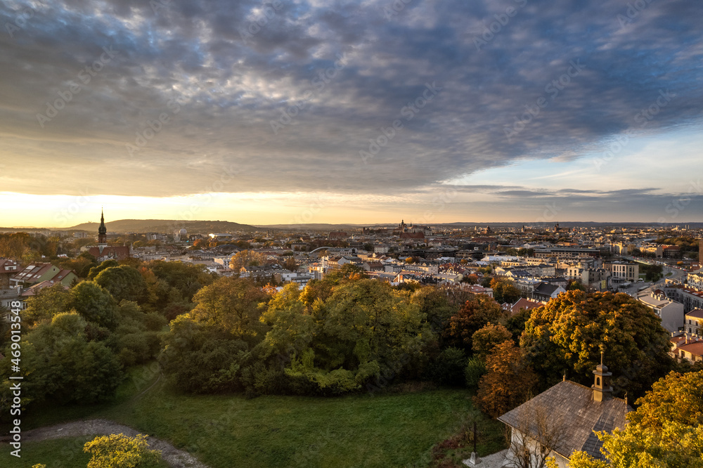 Sunset over St. Benedict's Church with panorama Krakow city center in the background