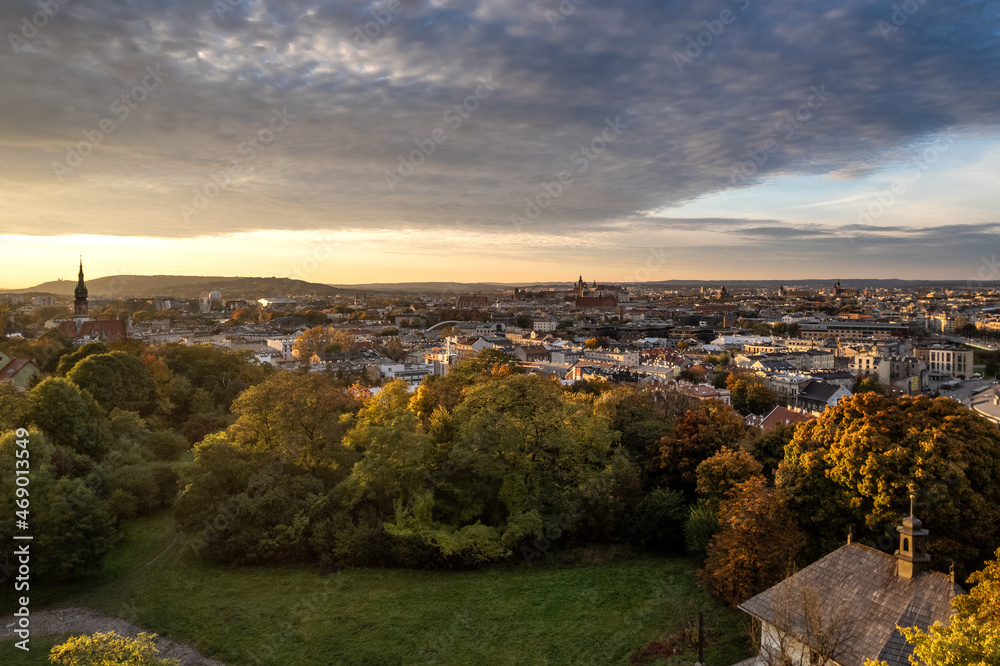 Sunset over St. Benedict's Church with panorama Krakow city center in the background