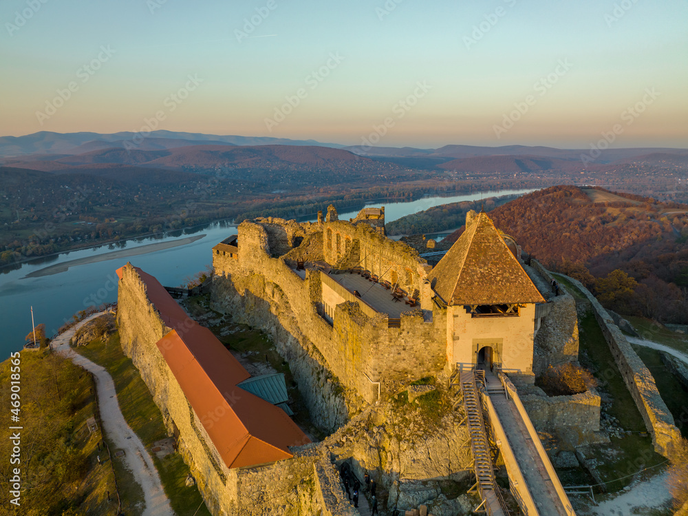Obraz premium Hungary - The historical Visegrad Castle near Danube river from drone view at sunset