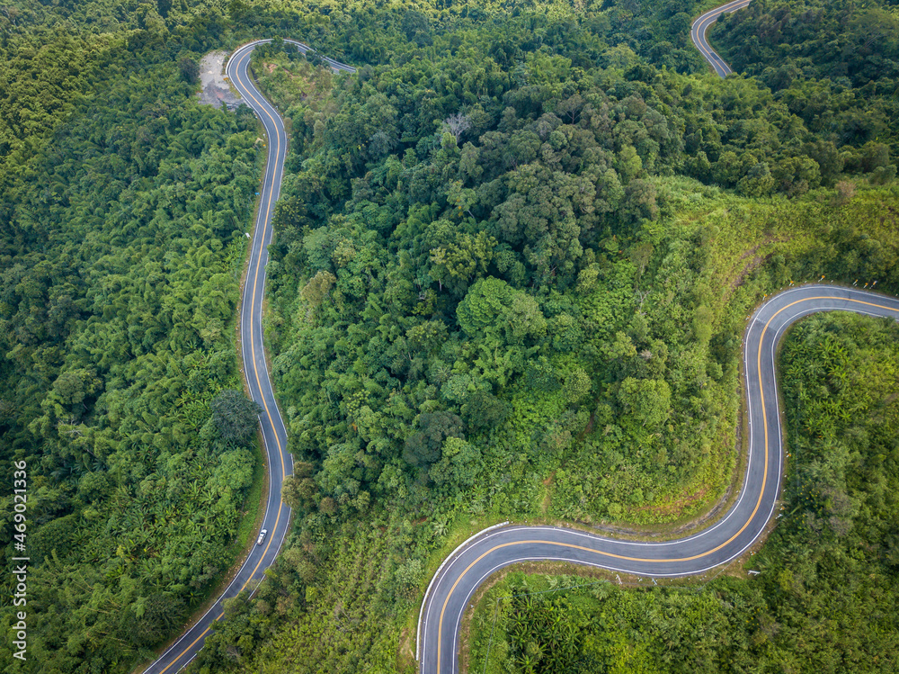 Aerial view of steep curve road in Northern region of Thailand. Northern Thailand's beautiful, rugged geography is the region's great temptation. Aerial view of steep curve road in Northern region of Thailand. Northern Thailand's beautiful, rugged geography is the region's great temptation.