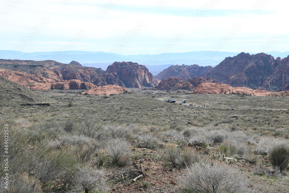 Sagebrush flats of Great Basin give way to red rocks and hot desert of the Mojave in the distance, Snow Canyon State Park, Utah Sagebrush flats of Great Basin give way to red rocks and hot desert of the Mojave in the distance, Snow Canyon State Park, Utah