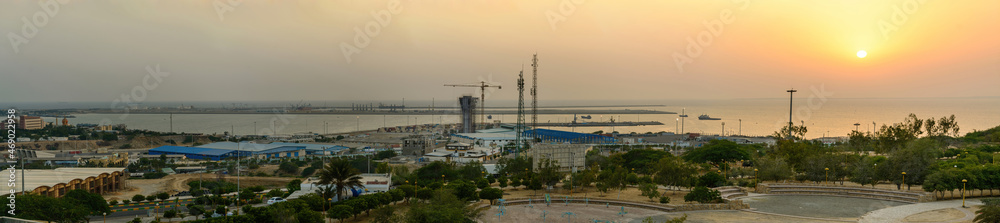 chabahar, iran 27 october 2021, panorama view from the international Port of Shahid Beheshti in chabahar with cargo ships at sunset, iran