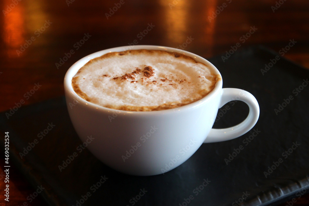 Obraz premium cup of hot cappuccino coffee