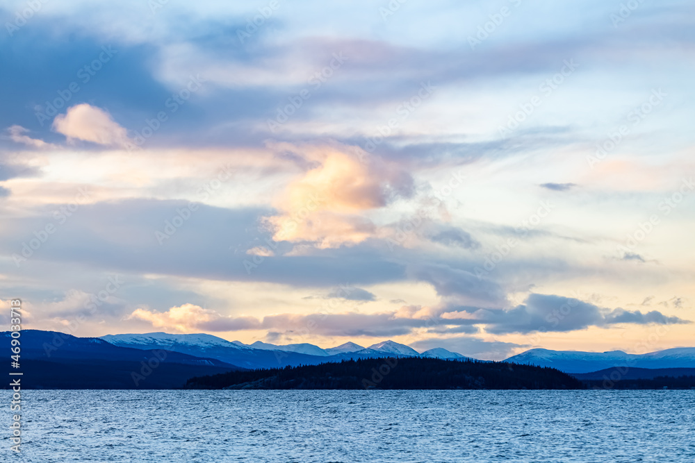 Stunning landscape sunset above mountains in wilderness of Yukon Territory, northern Canada.