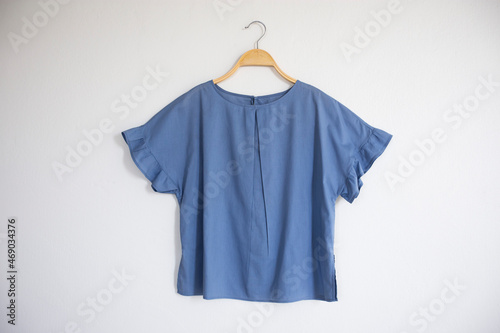 Tableau sur toile Woman blouse with blue blouse cotton on white background.