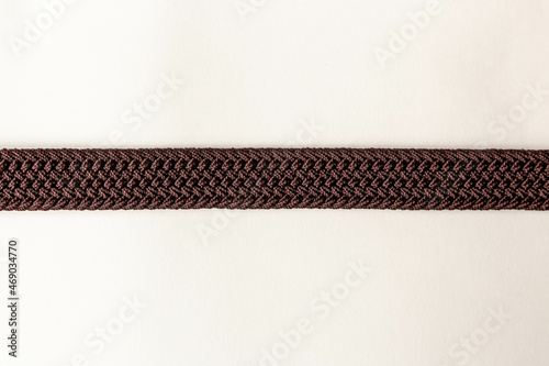 on a white background texture fabric woven brown strap