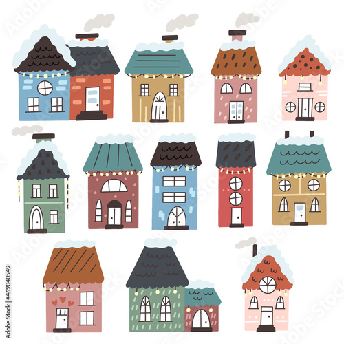 Set of Christmas winter houses in the snow with garlands. Village Cottages vector decorations in flat hand drawn style