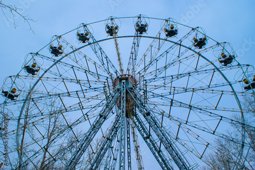 empty ferris wheel in amusement park over sky background