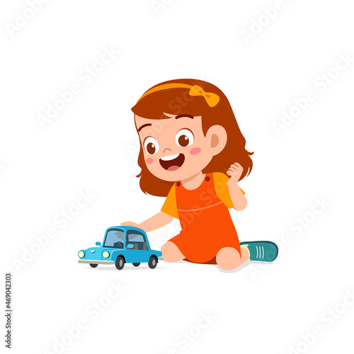 little girl play with small toy car