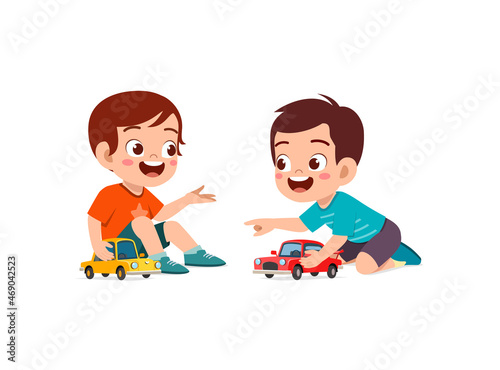 little boy play with small toy car with friend