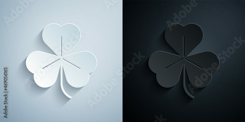 Paper cut Clover icon isolated on grey and black background. Happy Saint Patrick day. Paper art style. Vector