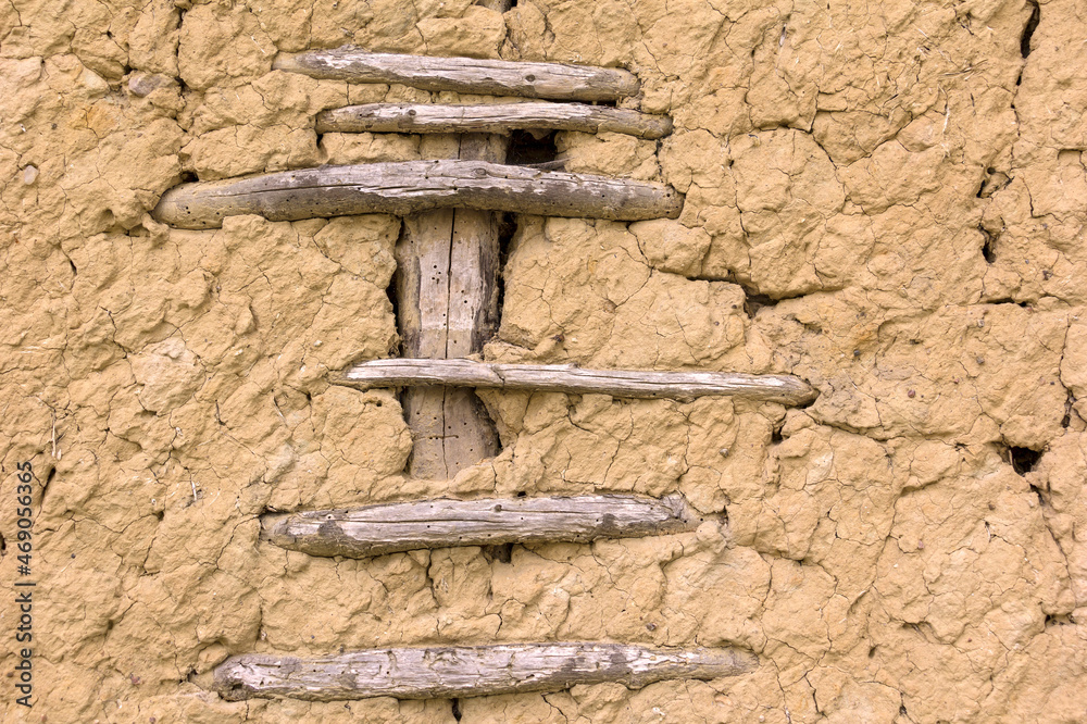 Detail of an old clay wall. Clay is a traditional building material.