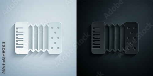 Paper cut Musical instrument accordion icon isolated on grey and black background. Classical bayan, harmonic. Paper art style. Vector