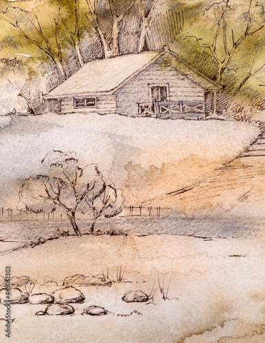 Wooden house on a hill. Behind the house there are trees.