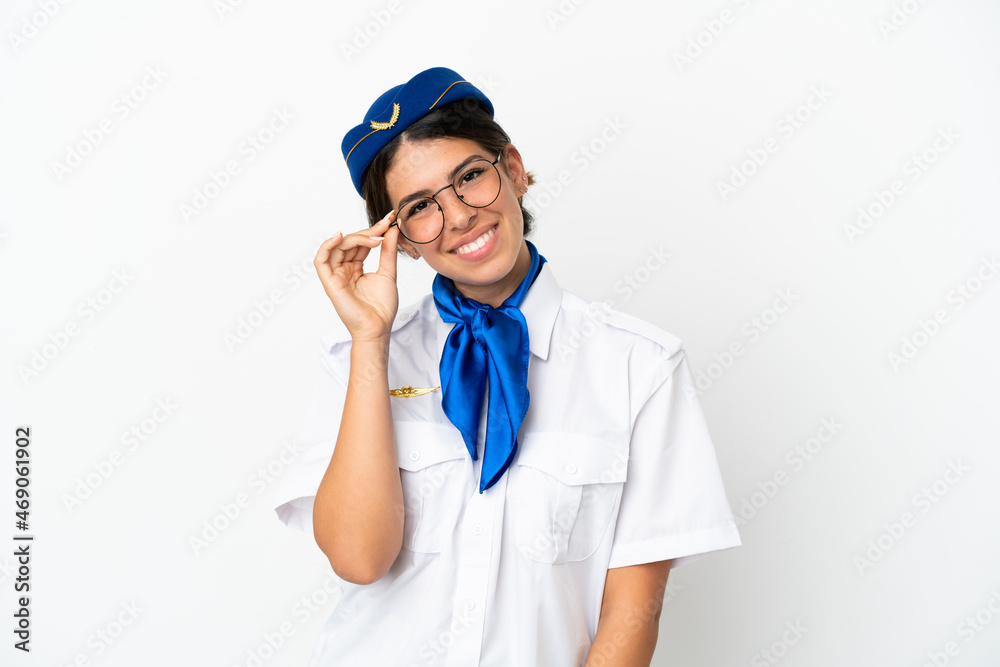 Airplane stewardess caucasian woman isolated on white background with glasses and happy Airplane stewardess caucasian woman isolated on white background with glasses and happy