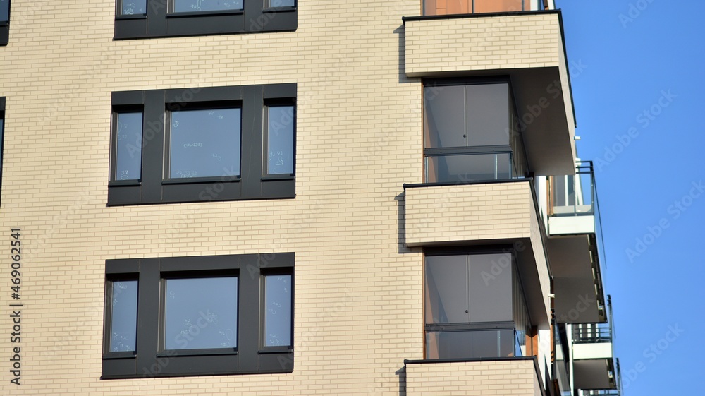 Fototapeta premium Modern apartment building in sunny day. Exterior, residential house facade.