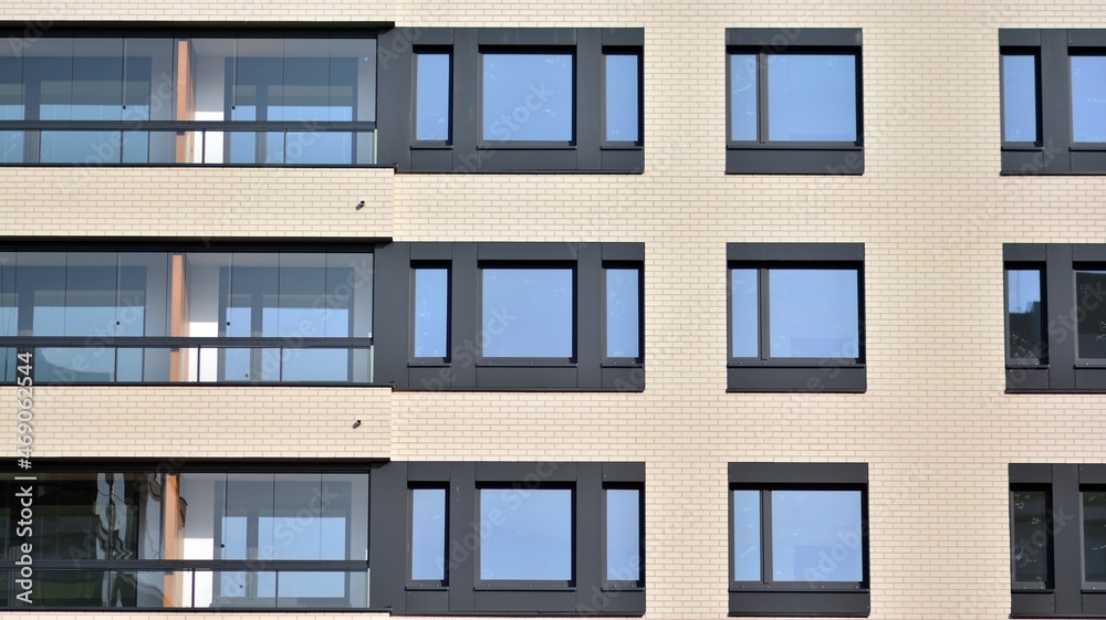 Modern apartment building in sunny day. Exterior, residential house facade.