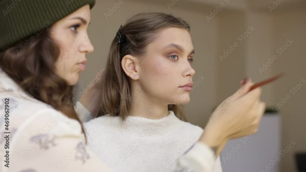 Makeup artist makes makeup for a beautiful model. Makeup artist makes makeup for a beautiful model.
