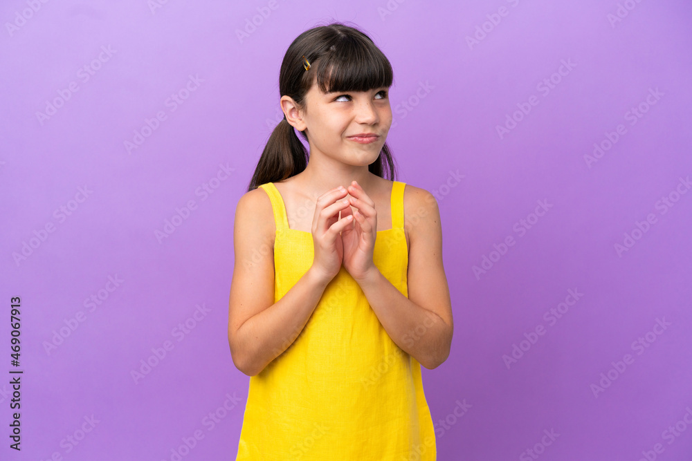 Little caucasian kid isolated on purple background scheming something Little caucasian kid isolated on purple background scheming something