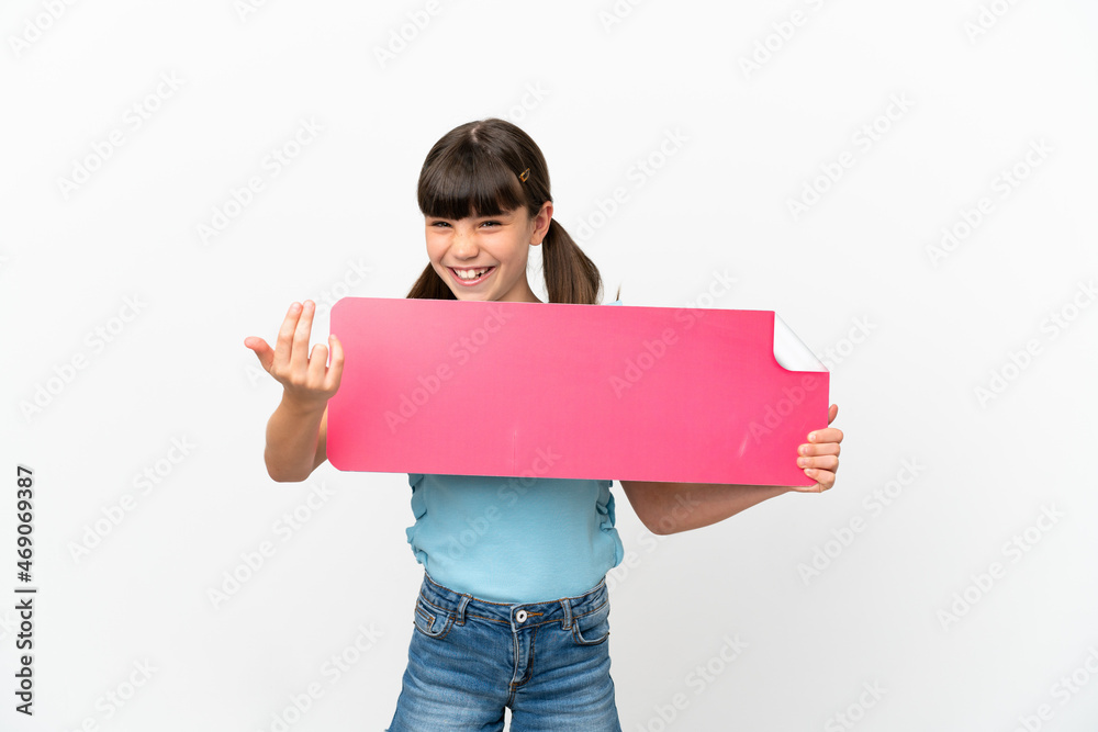 Little caucasian kid isolated on white background holding an empty placard and doing coming gesture Little caucasian kid isolated on white background holding an empty placard and doing coming gesture