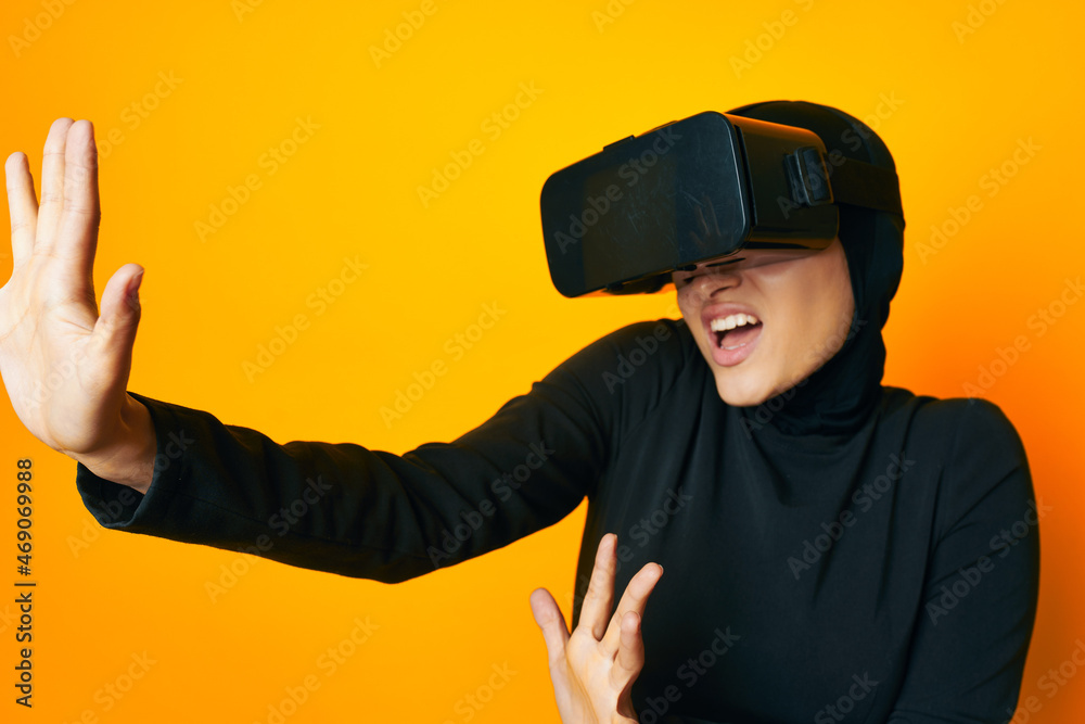cheerful woman in black hijab VR glasses emotions studio lifestyle cheerful woman in black hijab VR glasses emotions studio lifestyle